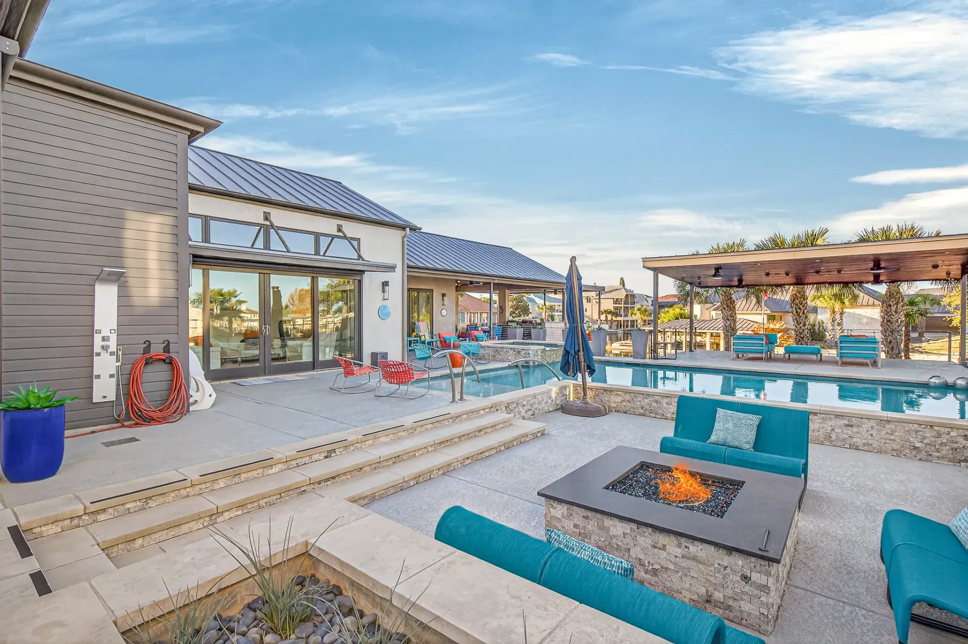 Outdoor patio with fire pit and pool